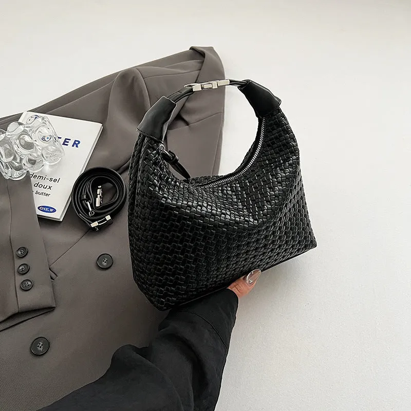 Soft PU leather messenger bag in bucket shape with internal document compartment, shown in a choice of colours.