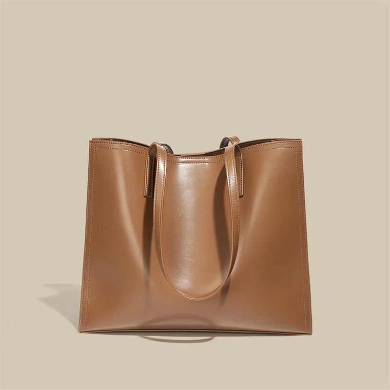 Women's brown genuine leather one-shoulder handbag with visible stitching and a single strap.