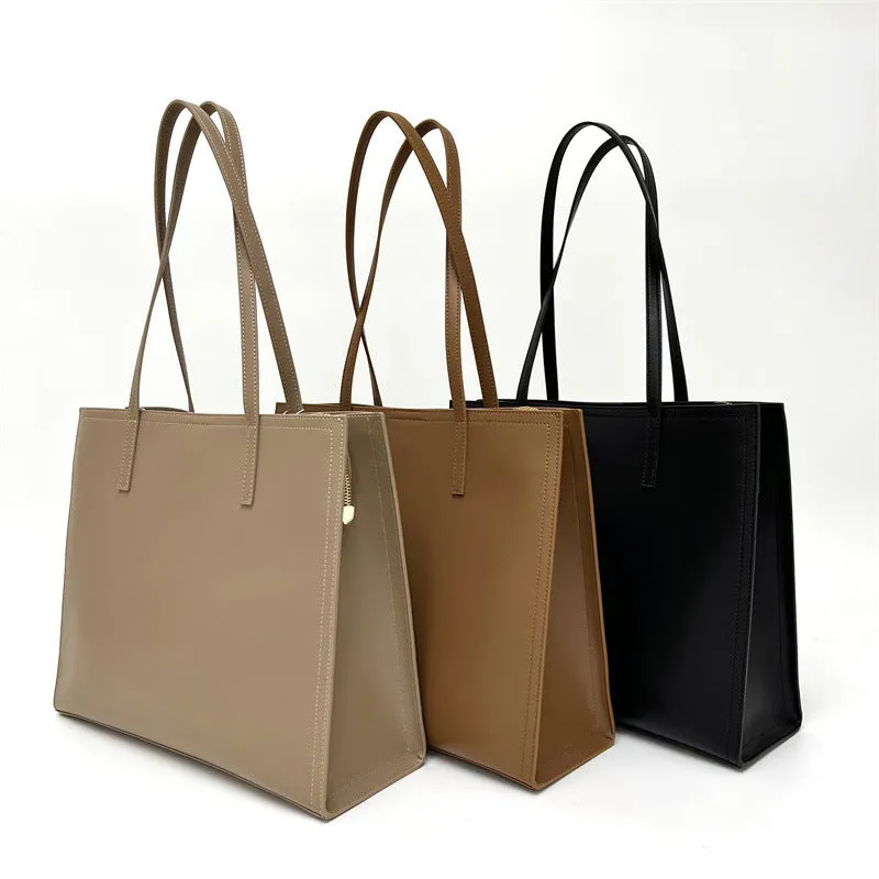Women's brown genuine leather one-shoulder handbag with visible stitching and a single strap.