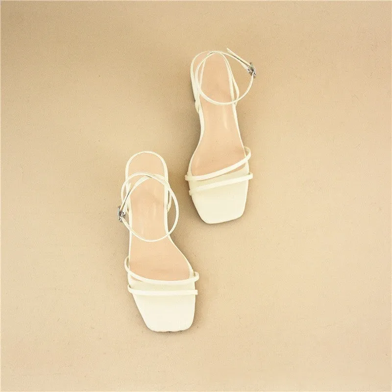 Beige women's sandals with a chunky stiletto heel, square toe, and adjustable ankle buckle on a white background.