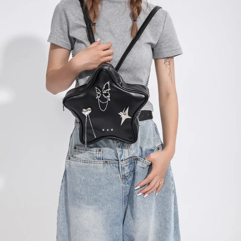 Black soft PU backpack with chain strap, metal butterfly pendant, and three-dimensional pockets.