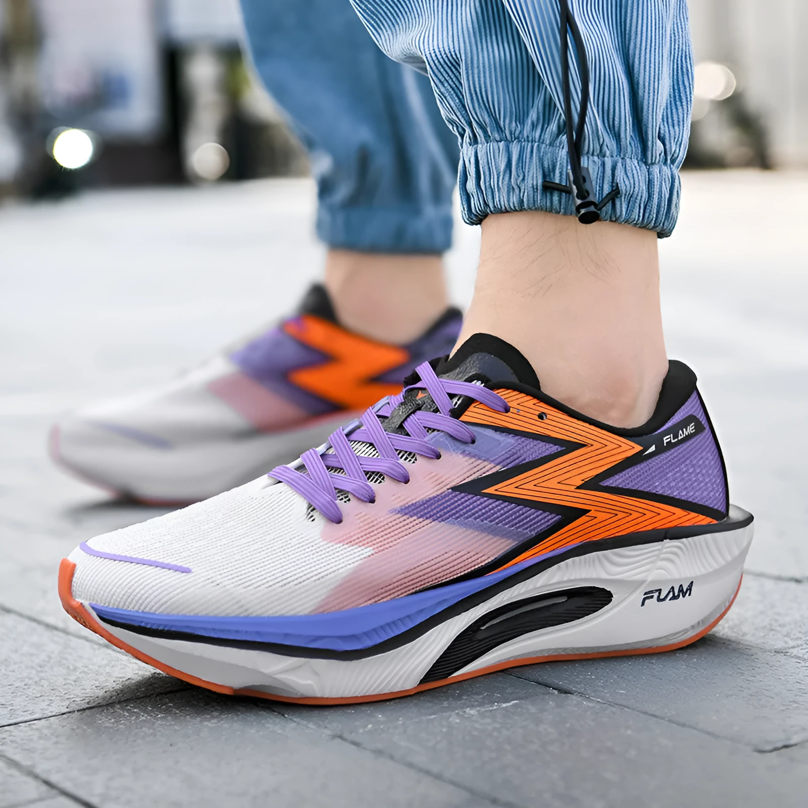 Marathon carbon plate racing running shoes in multiple colours with fabric upper and MD sole