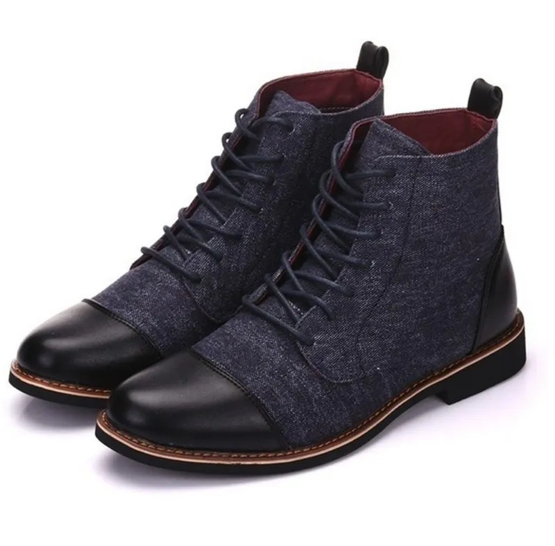 Men's black leather motorcycle boots with silver metal belt buckle fastenings on the side, showing a thick rubber sole.