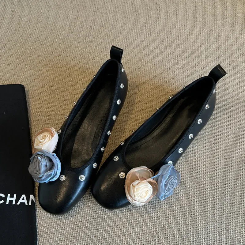 Silver Mary Jane buckle flats with DIY flower rivets on the strap, showing round toe and low top profile.