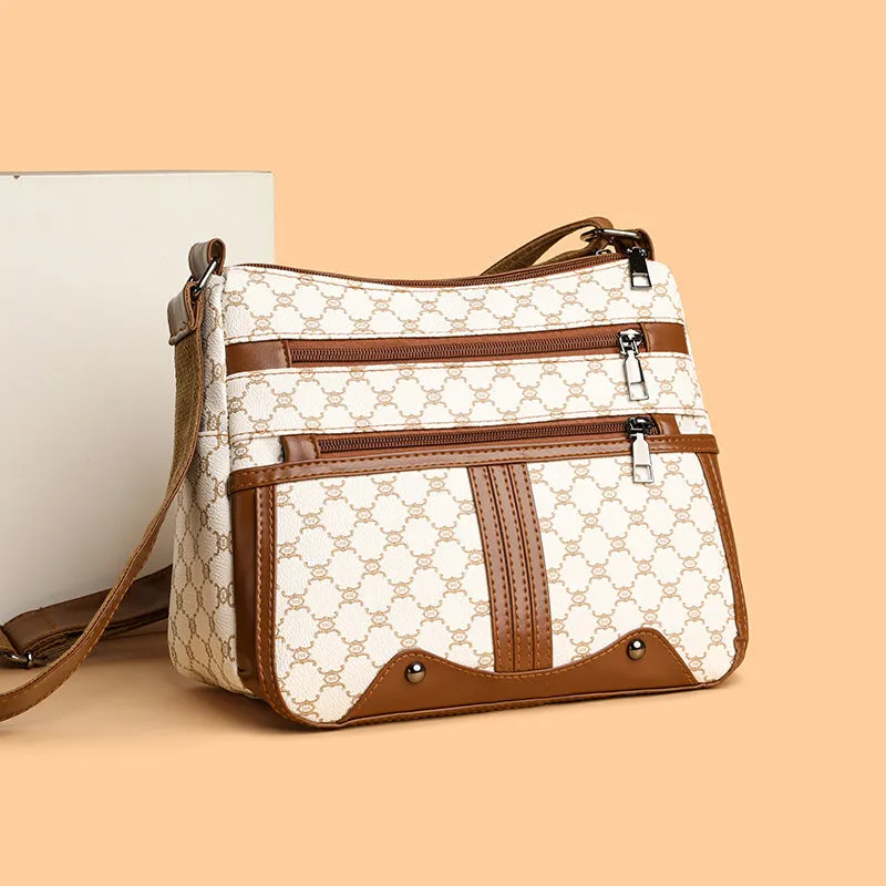 Women's brown and white stitching pattern large-capacity crossbody bag with PU exterior.