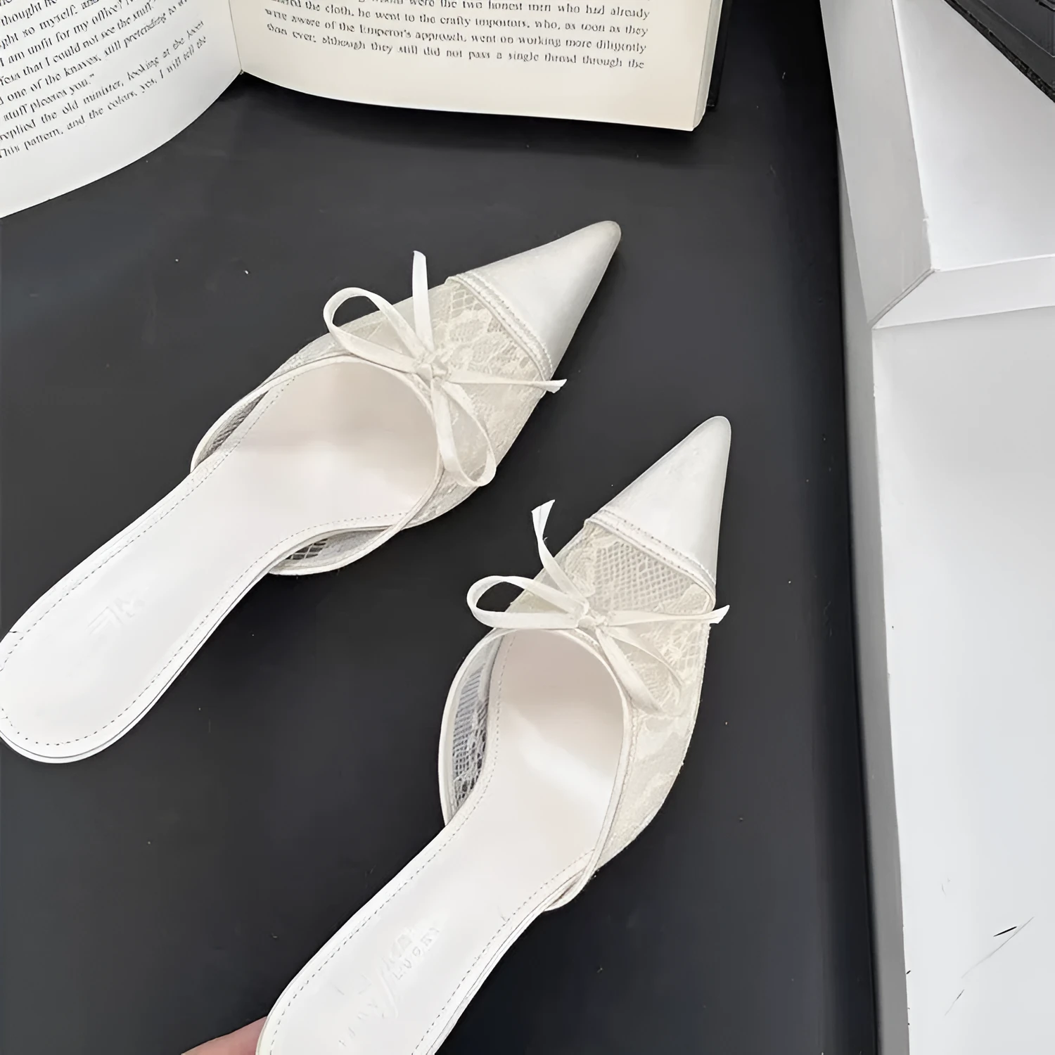 Women's apricot high heels with lace and bowknot detail on a pointed toe.