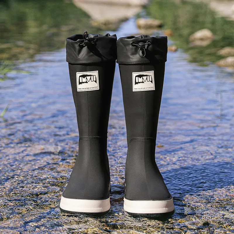 Solid colour high tube PVC rain boot in beige, shown on a white background.
