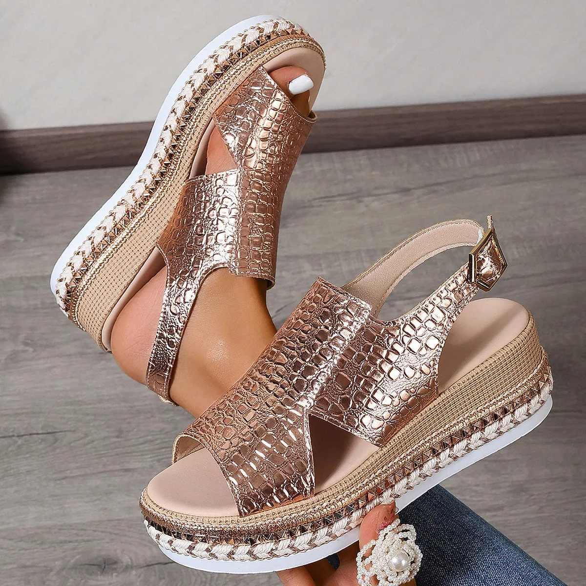 Gold Roman sandals with round toe, hollow-out pattern and adjustable ankle buckle