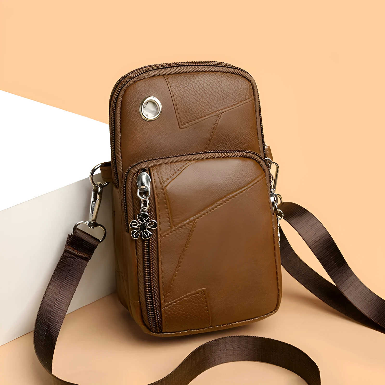 Brown PU leather vertical square mobile phone bag with crossbody strap and sandwich pocket.