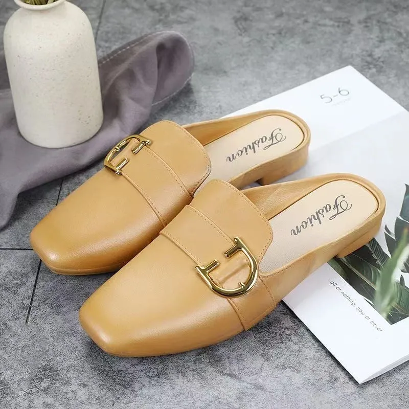 Women's closed toe PVC half slipper in milky white with a double buckle fastening.