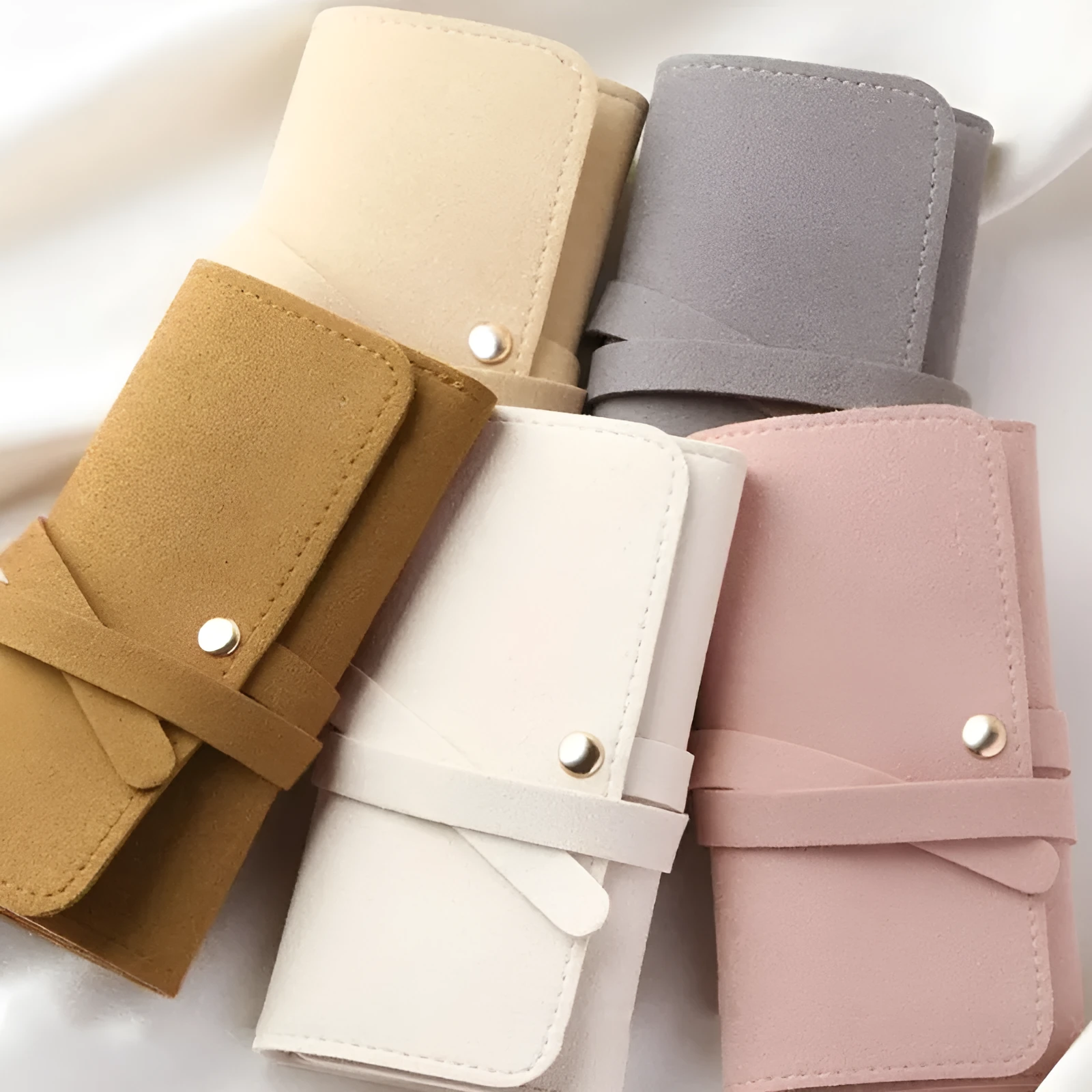 Brown leather 12x12cm jewellery storage bag with zip for earrings and watches.
