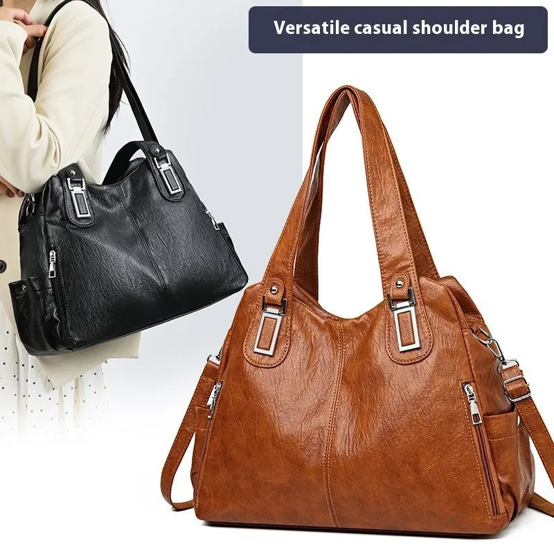 Soft PU square vertical tote bag with a single shoulder strap and internal zipper compartment.