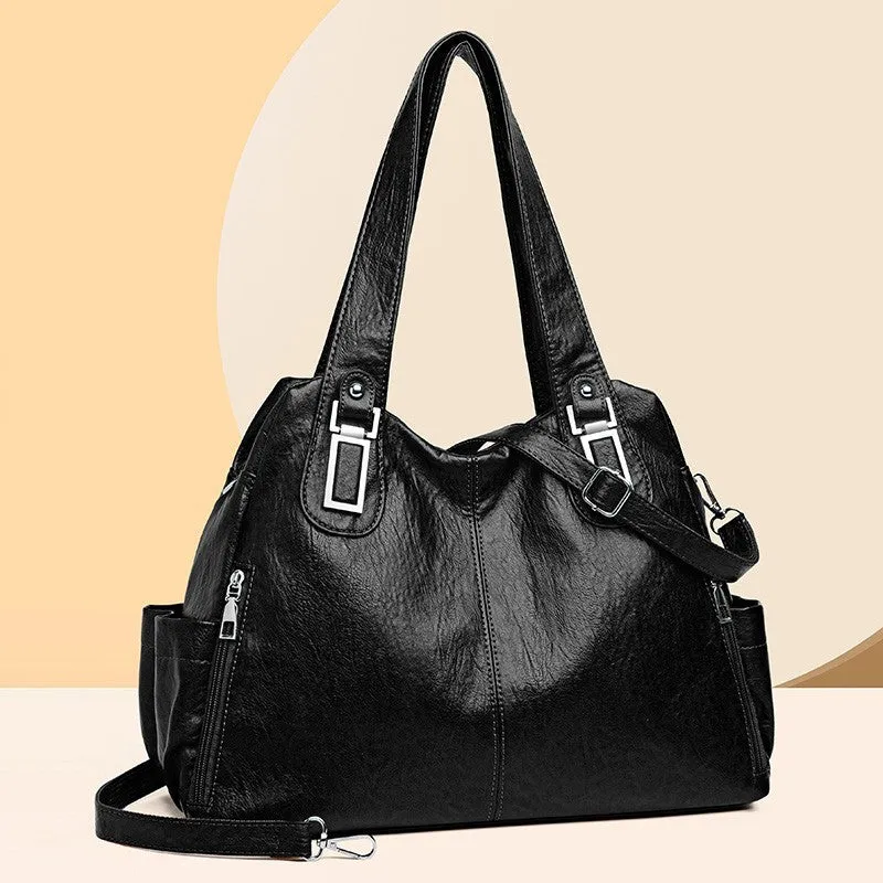 Soft PU square vertical tote bag with a single shoulder strap and internal zipper compartment.