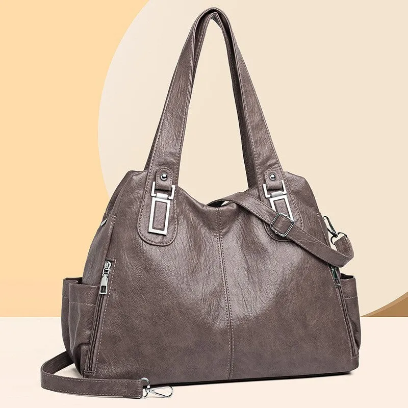 Soft PU square vertical tote bag with a single shoulder strap and internal zipper compartment.