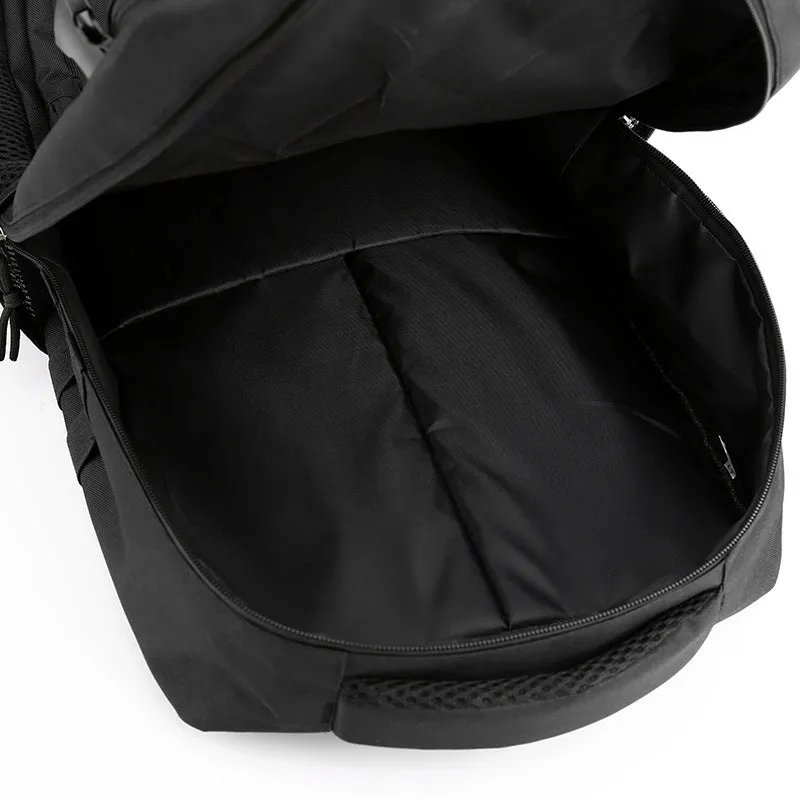 Outdoor mountaineering backpack in camouflage colour with curved shoulder straps and multiple compartments