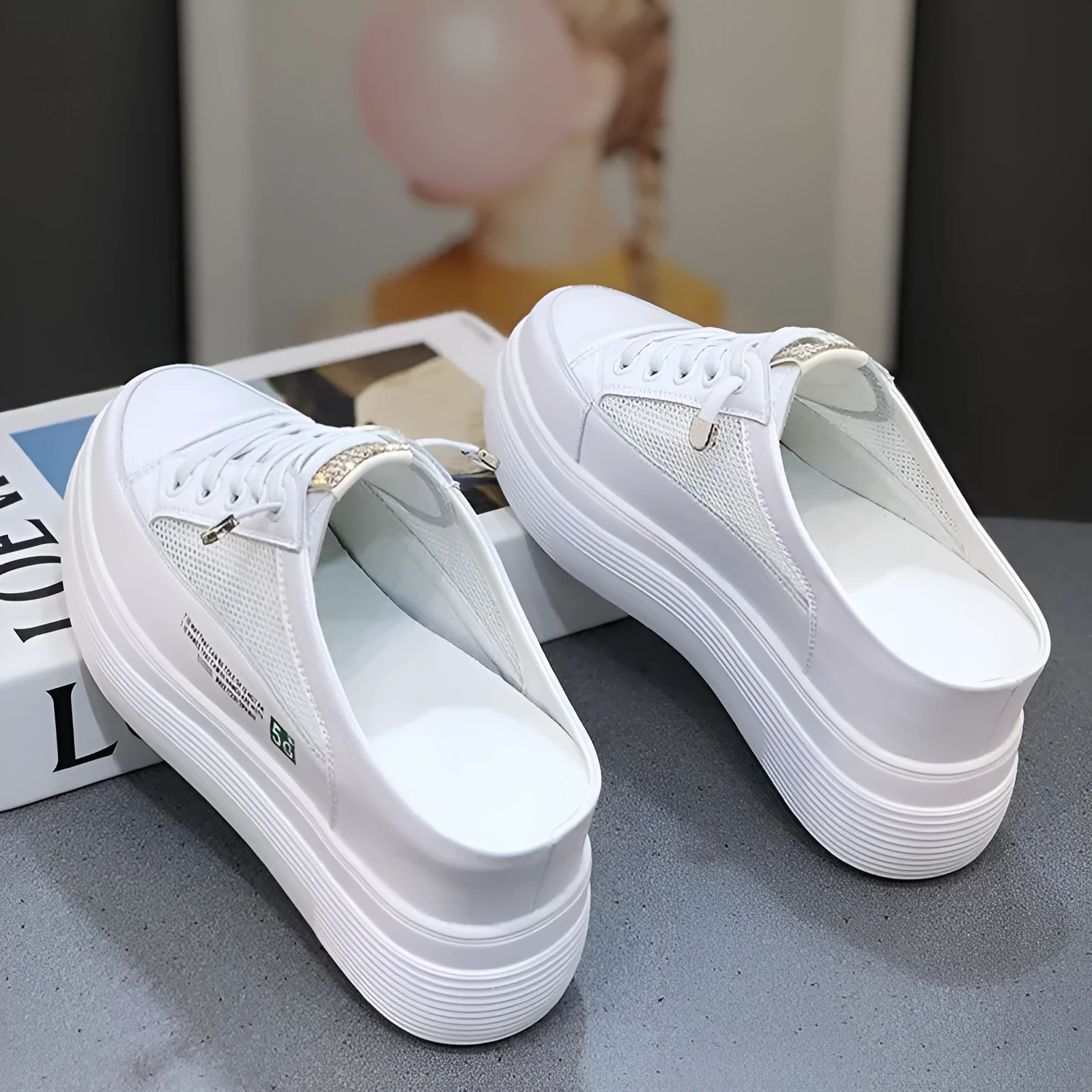 Women's white mesh platform sneakers with a round toe and rubber sole.