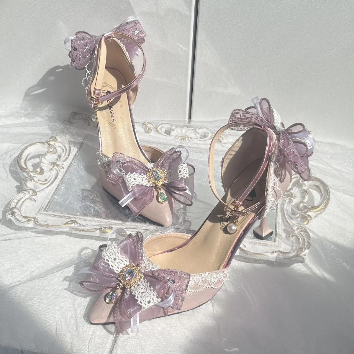 Purple satin women's stiletto shoes with a square toe bracket, shown on a white background.