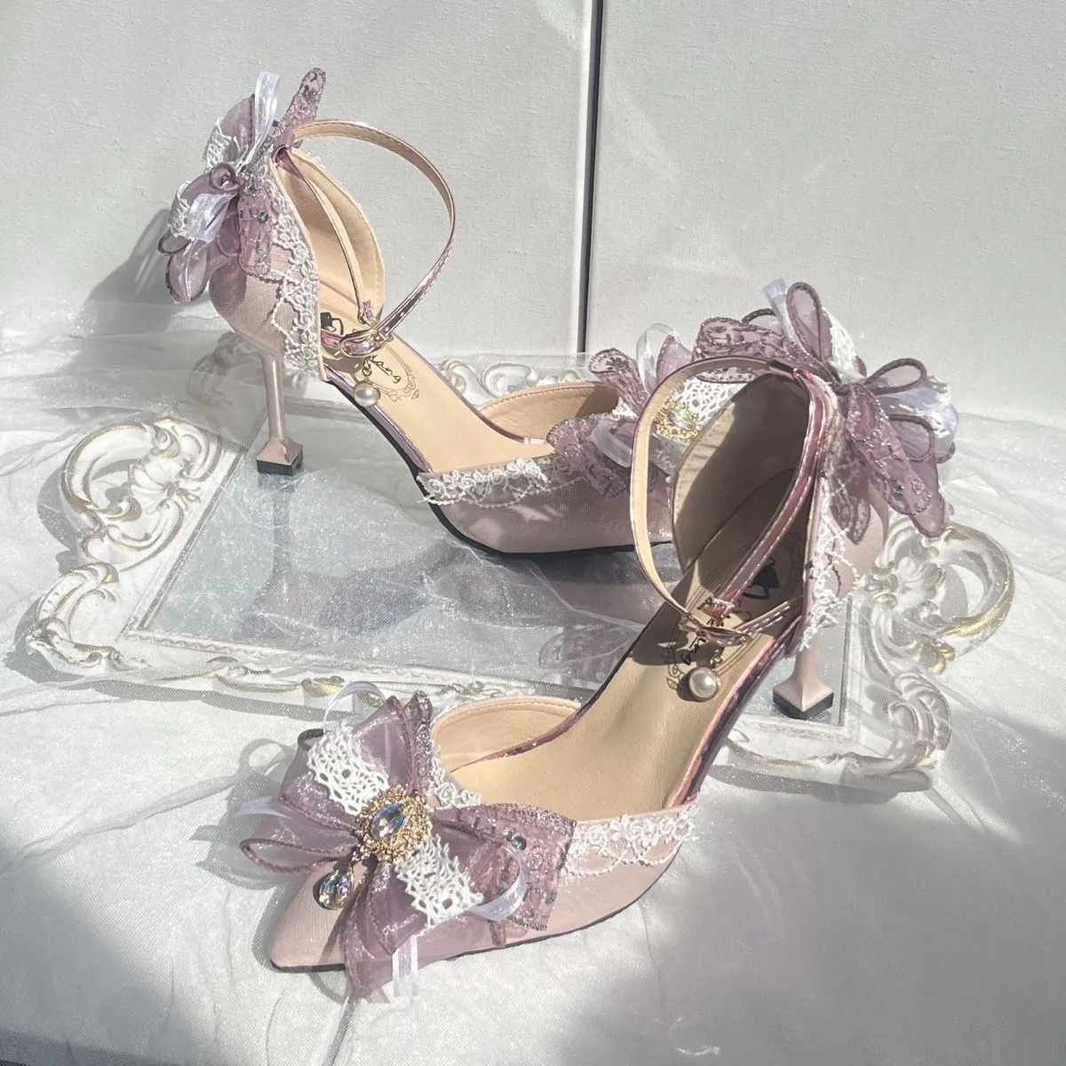 Purple satin women's stiletto shoes with a square toe bracket, shown on a white background.