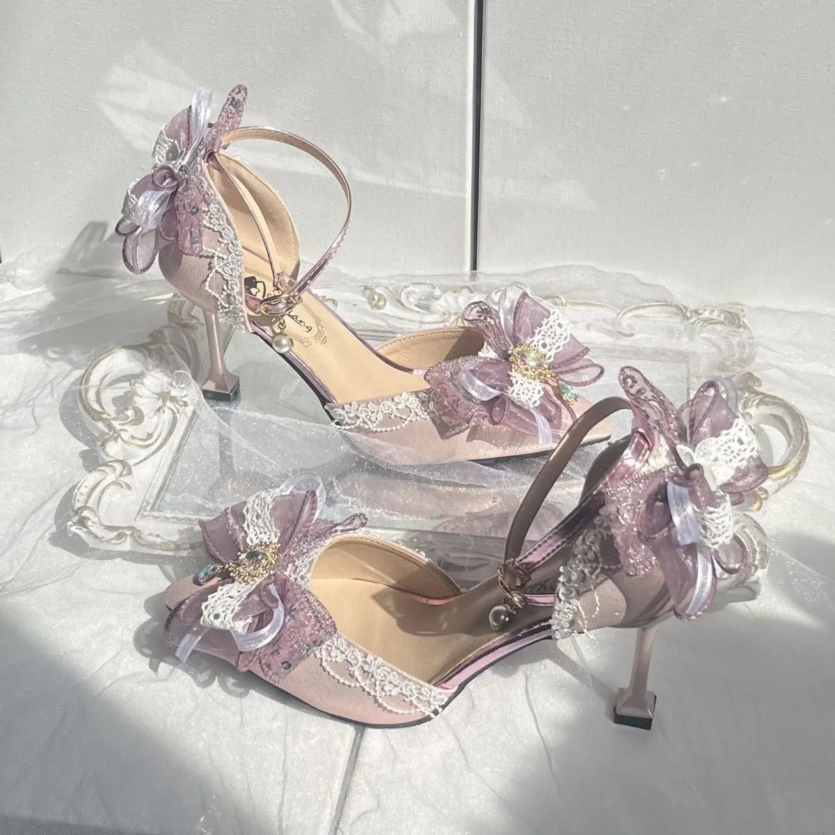 Purple satin women's stiletto shoes with a square toe bracket, shown on a white background.