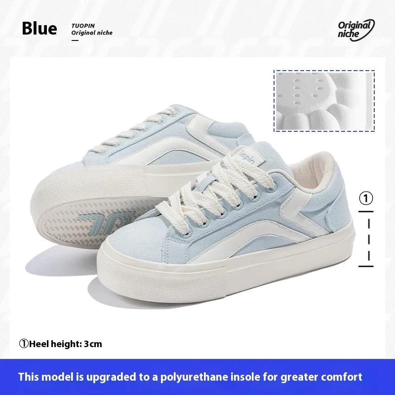 Women's low-top lace-up board shoes in blue, with a vulcanised rubber sole and round toe.