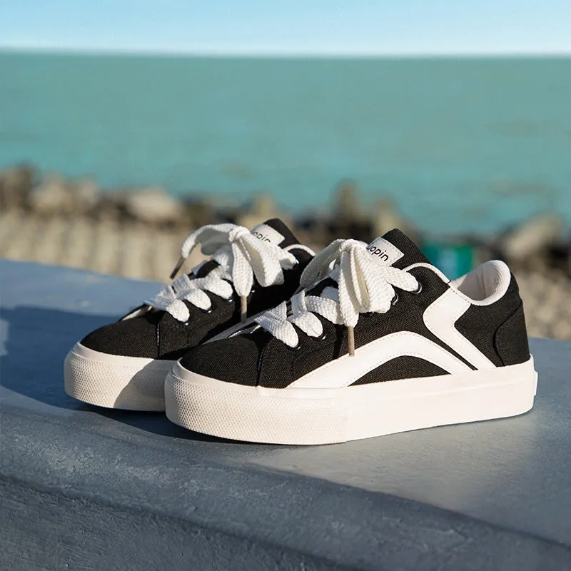 Women's low-top lace-up board shoes in blue, with a vulcanised rubber sole and round toe.