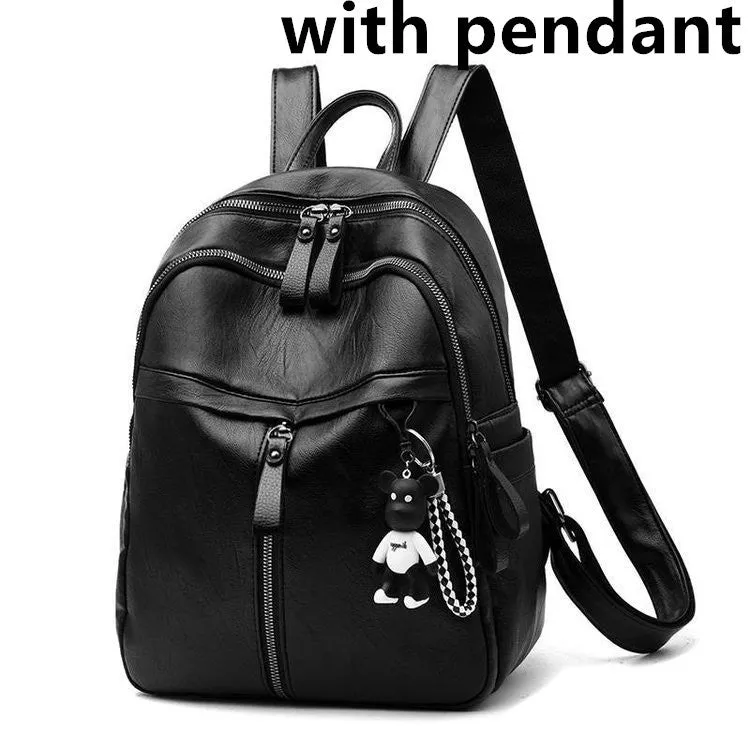 Black PU leather backpack with double straps, shown with and without a decorative pendant.