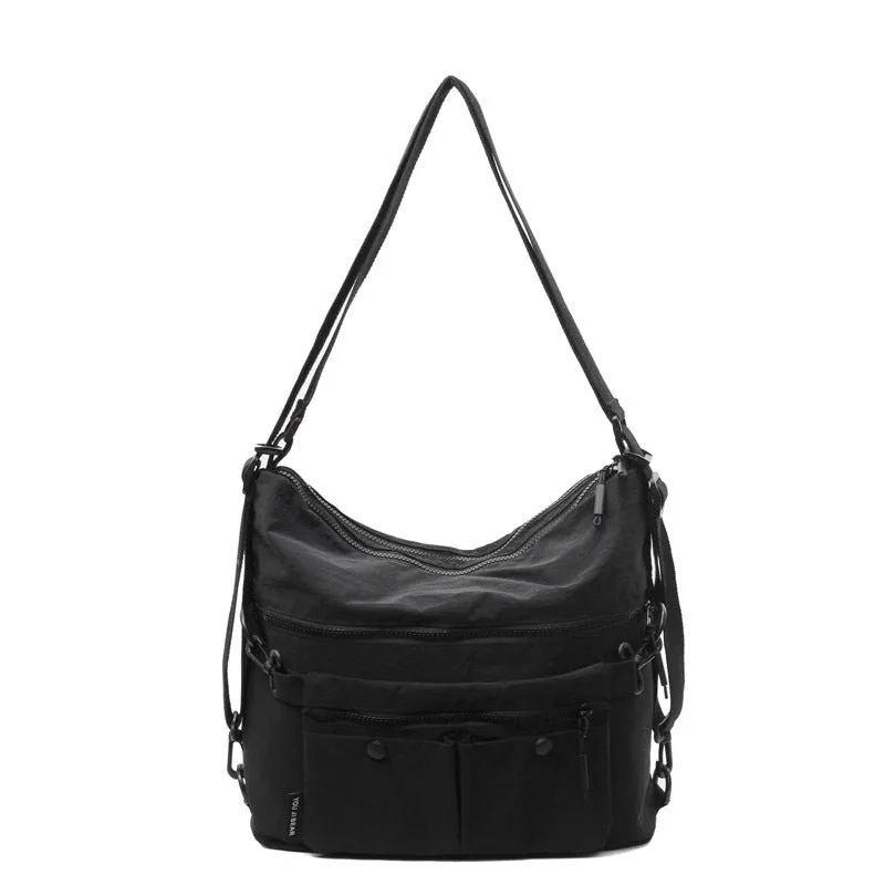 Women's nylon crossbody bag with double shoulder straps showing multiple pockets in black colour