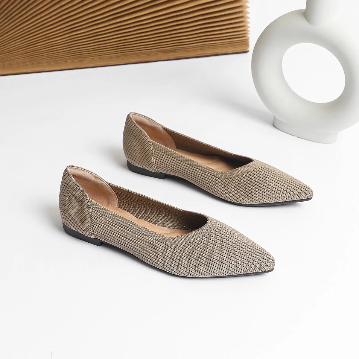 Women's apricot knit pointed flat pumps with a shallow mouth and rubber sole.