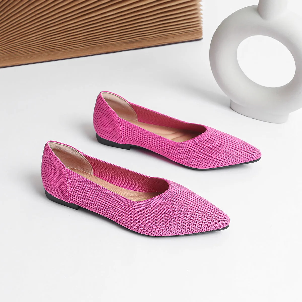 Women's apricot knit pointed flat pumps with a shallow mouth and rubber sole.