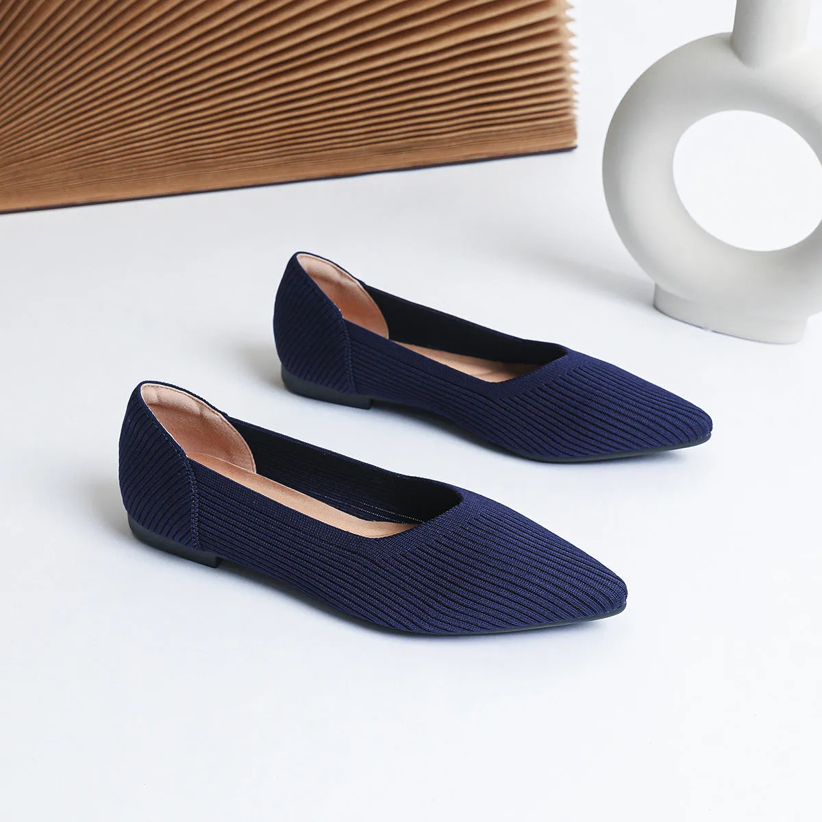 Women's apricot knit pointed flat pumps with a shallow mouth and rubber sole.