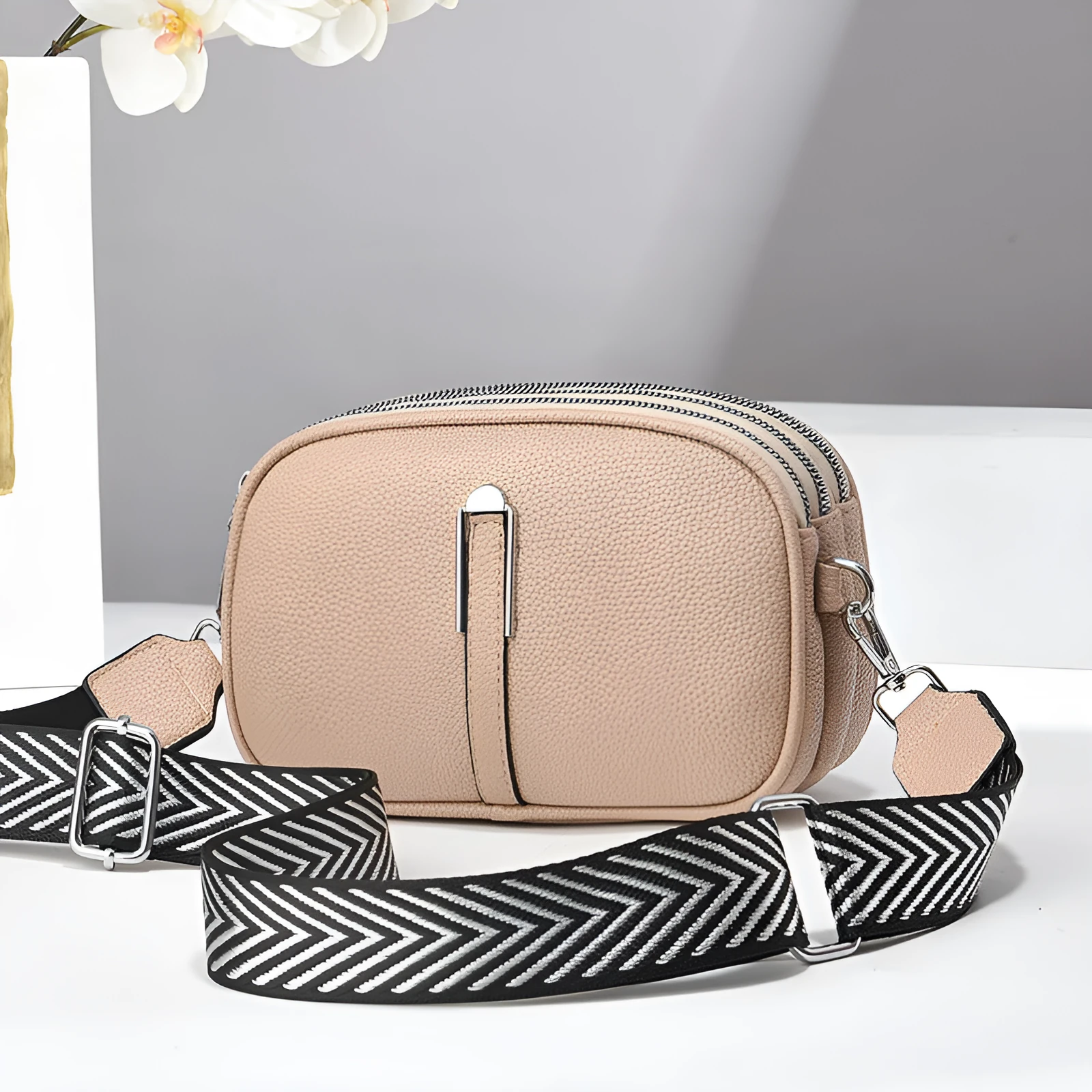 Soft PU leather crossbody bag in khaki colour with multiple compartments and stone pattern detail