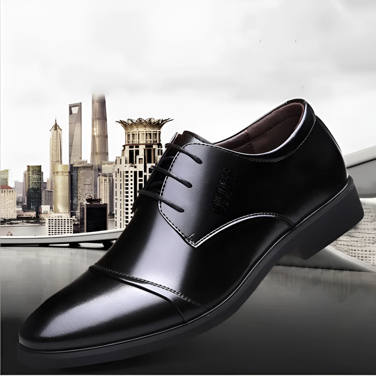 Men's black formal lace-up shoes with decorative stitching and horse buckle detail on rubber sole