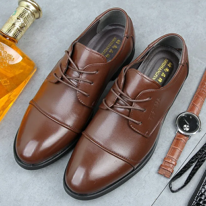 Men's black formal lace-up shoes with decorative stitching and horse buckle detail on rubber sole