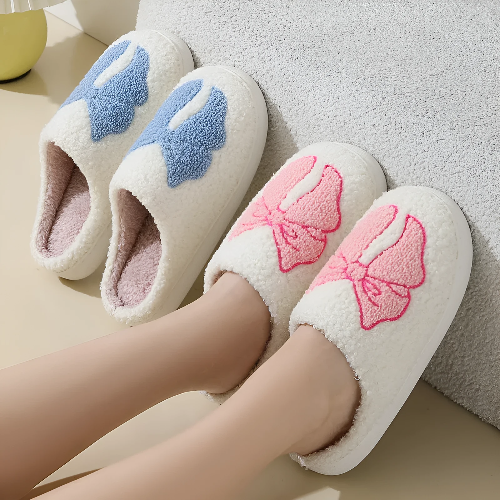 Pink and blue cartoon bow knot oversleeve slippers with suede upper and TPR sole.