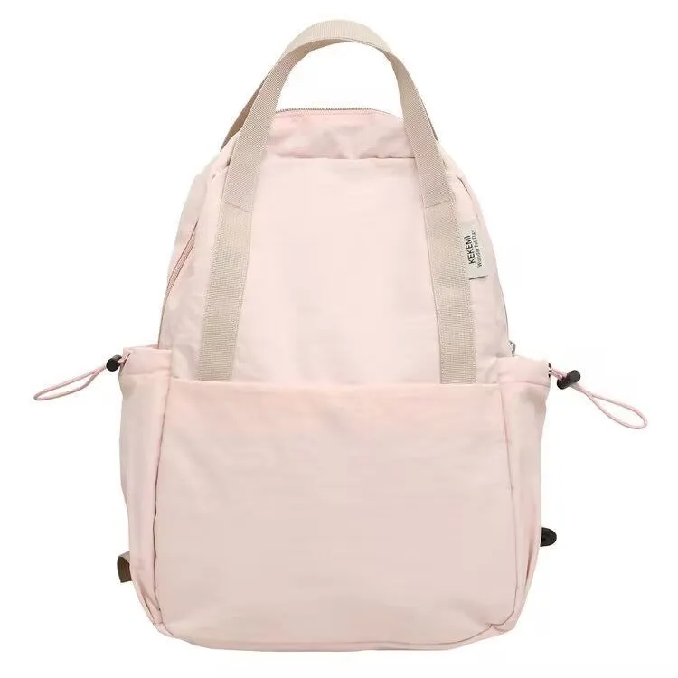 Solid colour nylon backpack in blue with curved straps and a lock, shown in a travel setting.