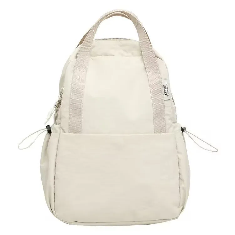 Solid colour nylon backpack in blue with curved straps and a lock, shown in a travel setting.