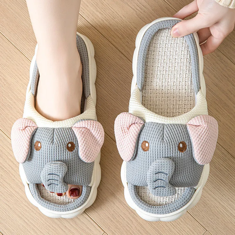 Elephant grey linen open-toe slippers for couples on a plain background, showing hand-sewn PVC sole.