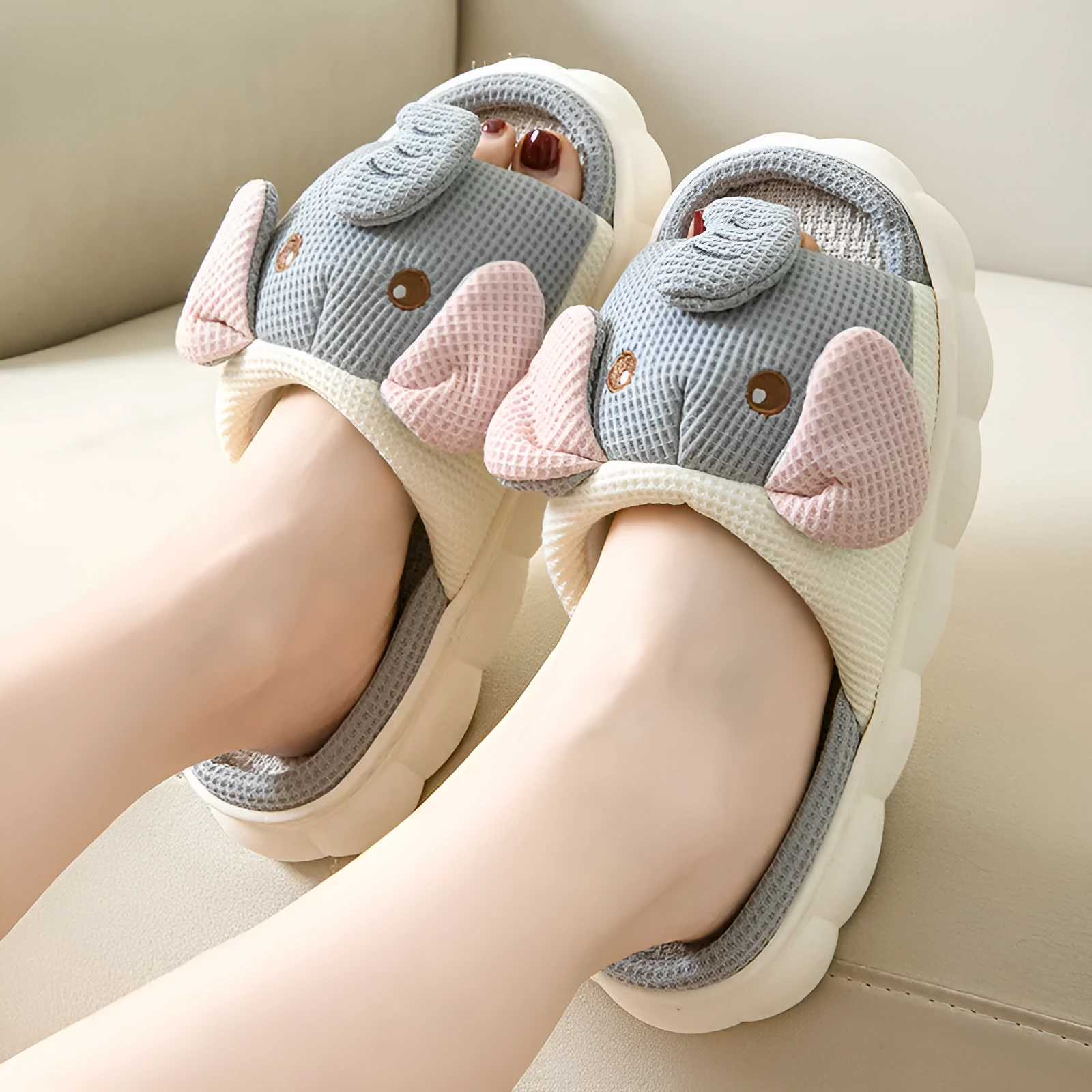 Elephant grey linen open-toe slippers for couples on a plain background, showing hand-sewn PVC sole.