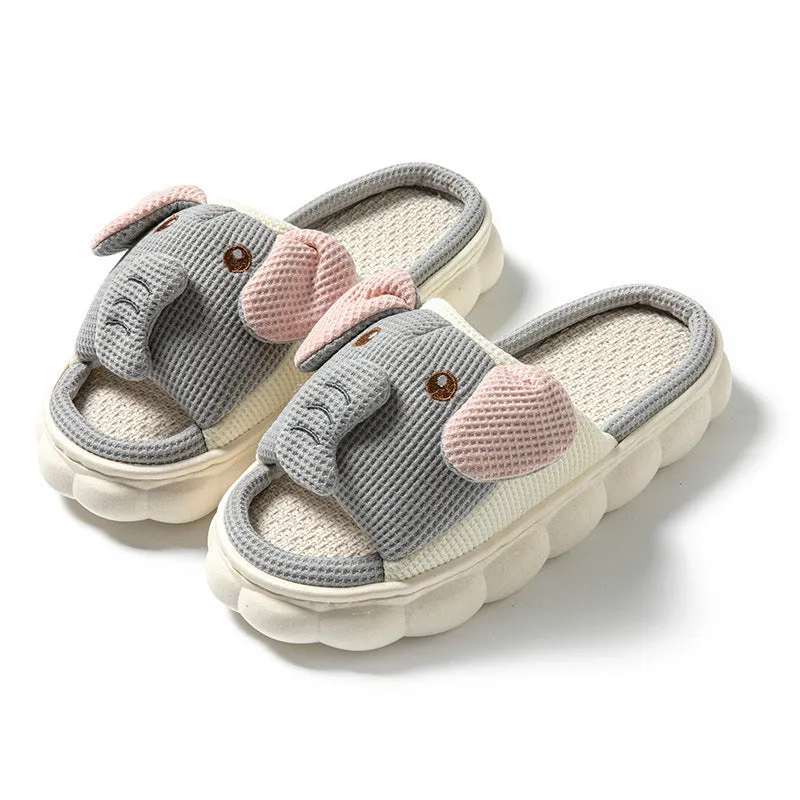Elephant grey linen open-toe slippers for couples on a plain background, showing hand-sewn PVC sole.
