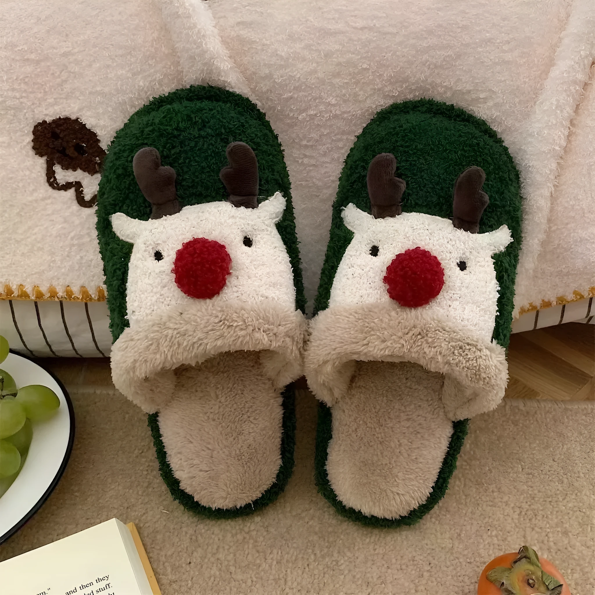 Women's green Christmas deer plush slippers with non-slip PVC soles.