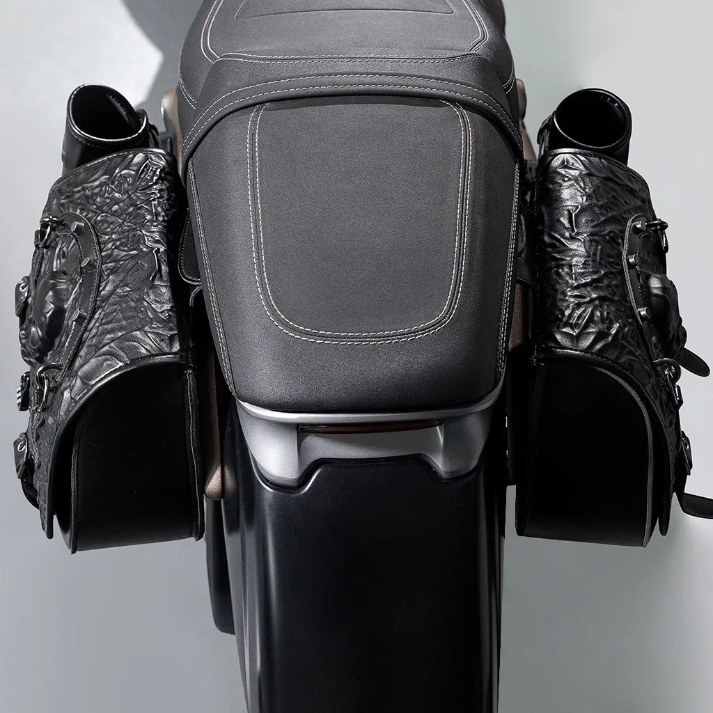 Pair of black PU synthetic leather motorcycle side luggage bags mounted on a modified bike frame.