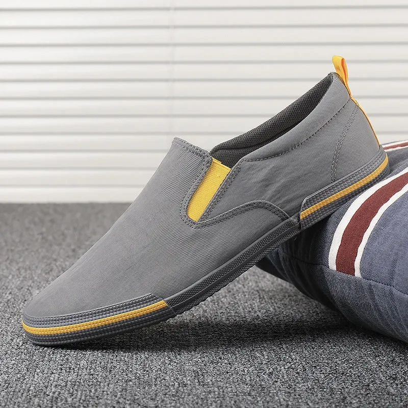 Men's casual canvas sneakers in grey, black orange, and khaki with vulcanised rubber soles
