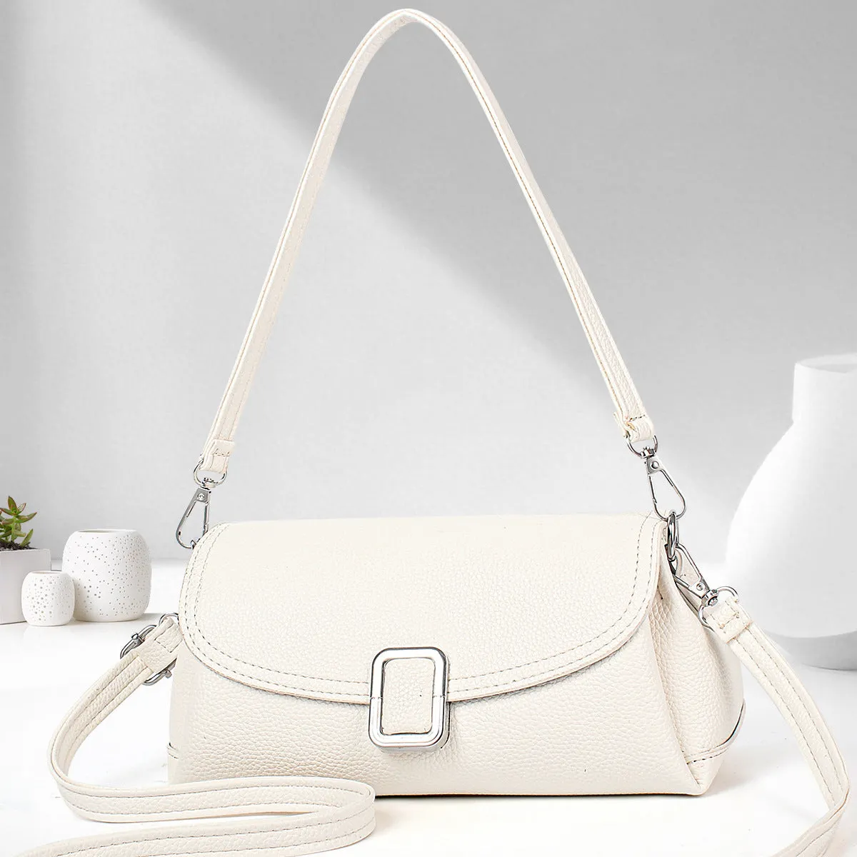 Women's PU leather shoulder handbag in crossbody design with adjustable strap showing beige colour option
