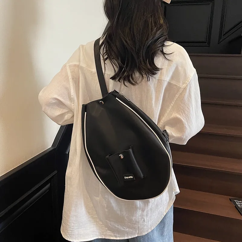 Black one-shoulder yoga storage bag with large 36-55 litre capacity and a single strap.