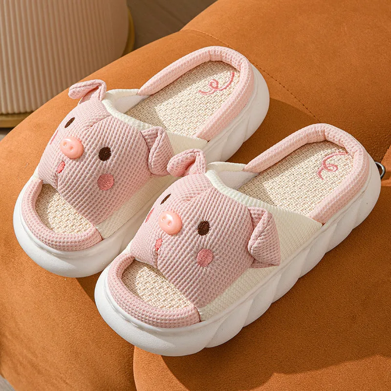 White linen open toe flip flop slippers for couples on a light background, showing PVC sole and strap detail.