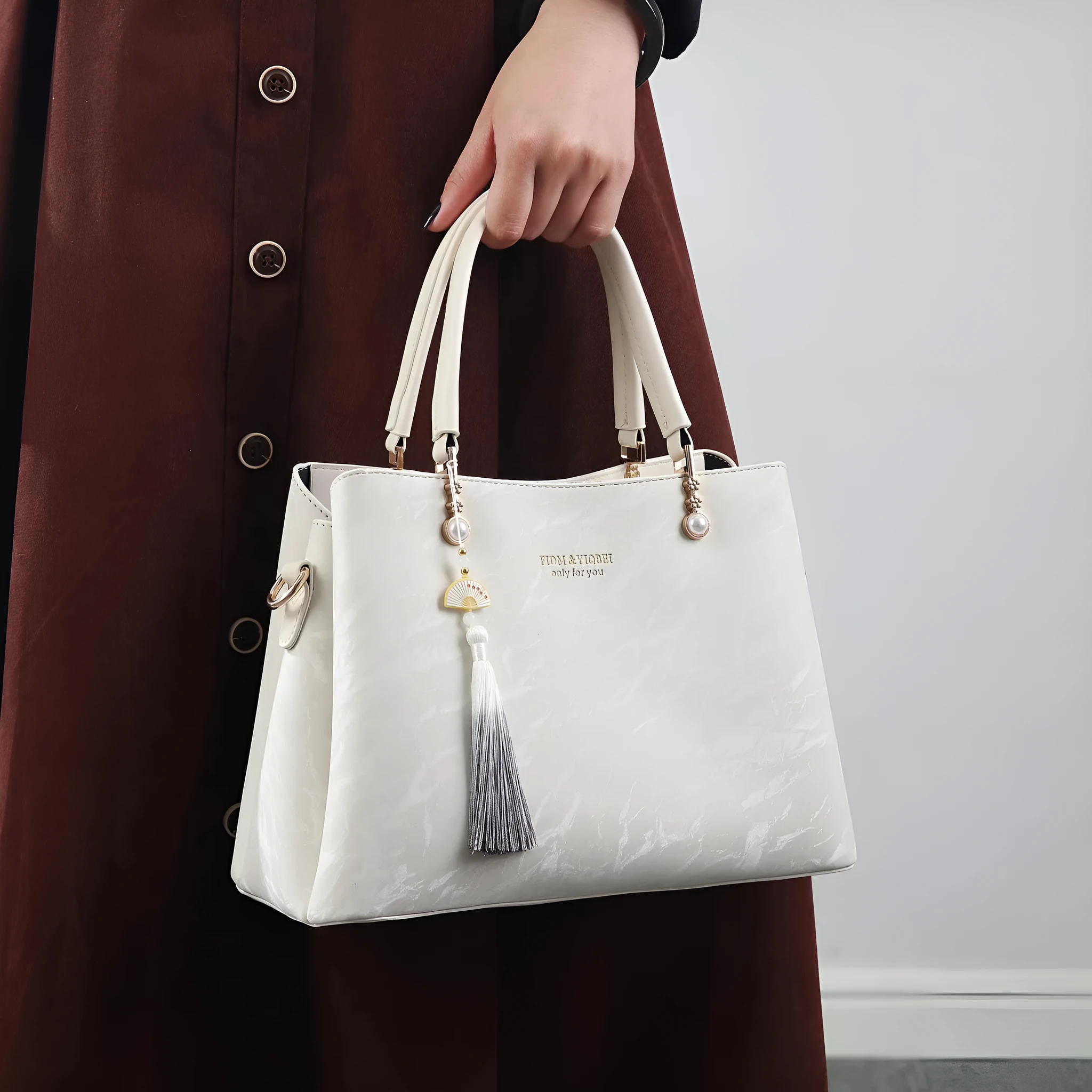 Women's PU leather shoulder bag with horizontal square shape and slit pockets in ethnic-style finish