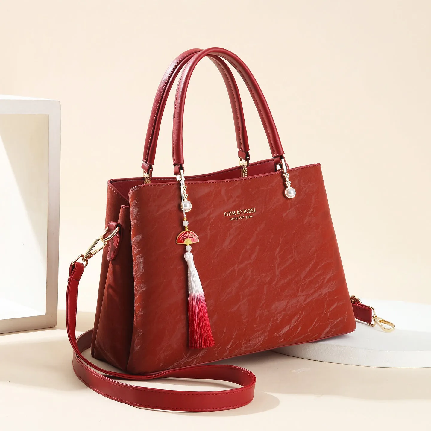 Women's PU leather shoulder bag with horizontal square shape and slit pockets in ethnic-style finish
