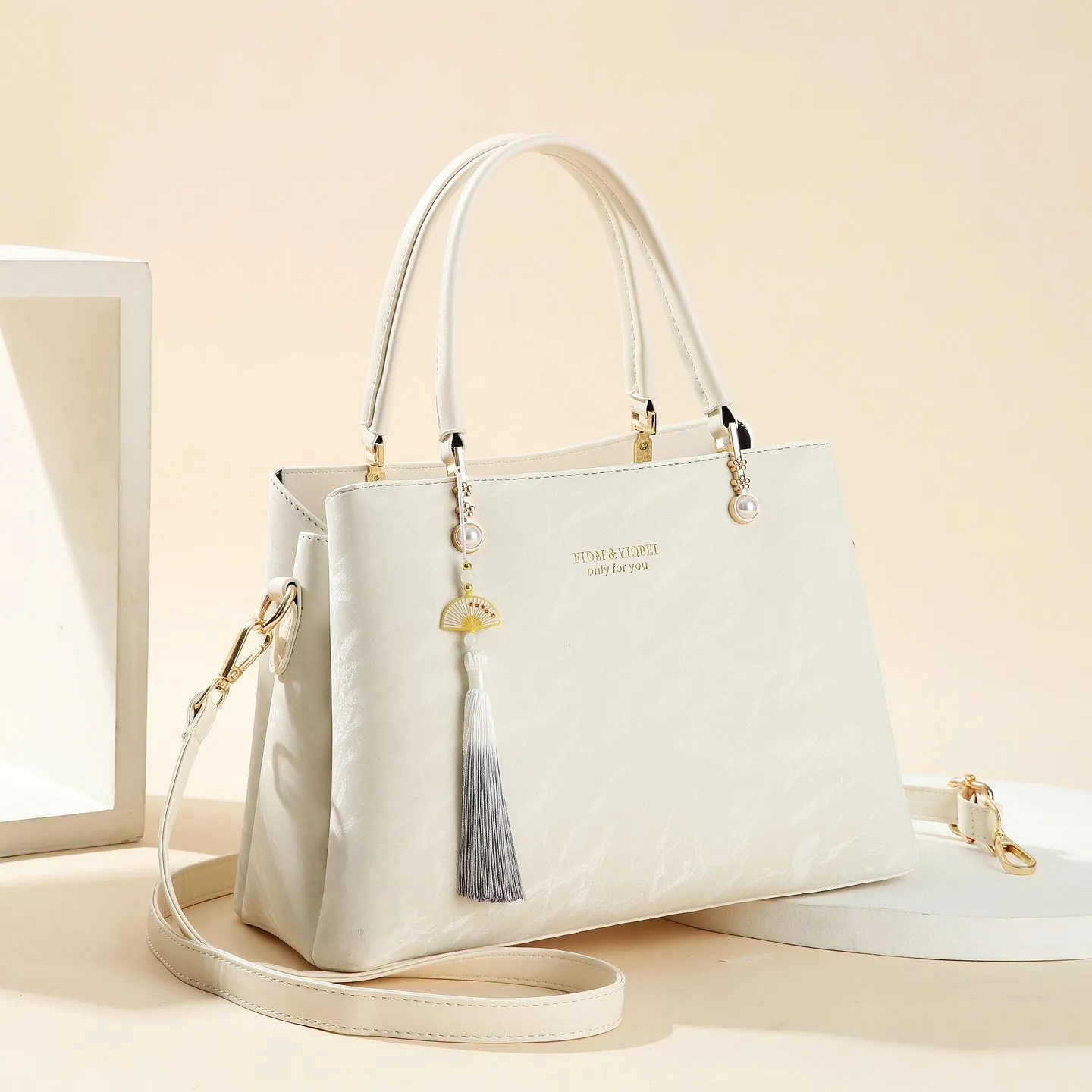 Women's PU leather shoulder bag with horizontal square shape and slit pockets in ethnic-style finish