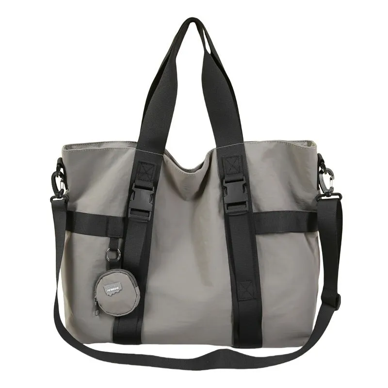 Grey Oxford cloth men's travel shoulder bag showing main compartment and detachable coin purse.