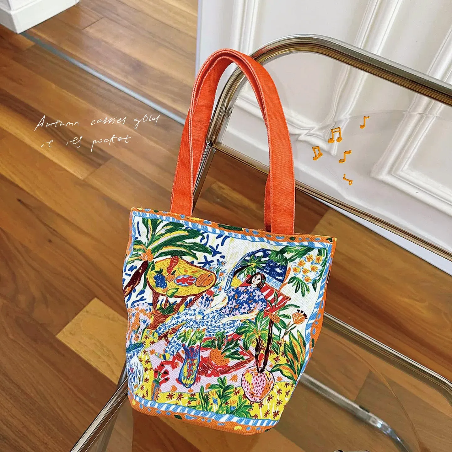 Dream Garden orange plush bucket bag with printed design, canvas lining, and double shoulder straps